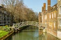 Typical mysterious old English dark street after rain in Cambridge.Mathematical Bridge, Queens College Cambridge, UK