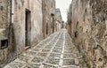 Typical narrow stone street in the medieval historical center of Erice, province of Trapani in Sicily.
