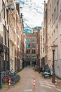 Typical narrow street in Amsterdam with dancing houses and bikes, Netherlands Royalty Free Stock Photo