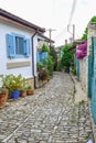 Typical narrow winding cobbled street in the village of Lania, C