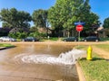 Typical neighborhood area with stop sign near Dallas, Texas, America with open yellow fire hydrant