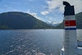 typical norwegian car ferry crossing a beautiful fjord Royalty Free Stock Photo