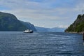 typical norwegian car ferry crossing a beautiful fjord Royalty Free Stock Photo