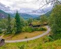 Typical norwegian cloudy summer day in Stalheim, Norway. Tradational wooden houses with moss on roof Royalty Free Stock Photo
