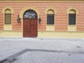 Typical Novi Sad old town street view in Serbia with old doors and windows and vintage candelabre Royalty Free Stock Photo