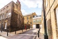 Typical old English buildings, low brick buildings across a narrow street, interesting old London architecture. Royalty Free Stock Photo