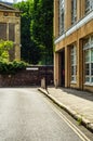 Typical old English buildings, low brick buildings across a narrow street, interesting old London architecture Royalty Free Stock Photo