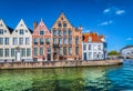 Canal in Bruges with beautiful Belgian brick houses. Royalty Free Stock Photo