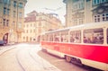 Typical old retro vintage tram on tracks near tram stop in the streets of Prague city in Lesser Town Royalty Free Stock Photo