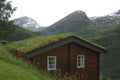 Typical old wood house with grassroof in the fjords of Geiranger in Norway Royalty Free Stock Photo
