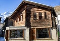 Typical old wooden house with a shop on the ground floor