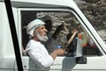 Typical Omani man driving a car Royalty Free Stock Photo