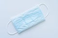 Typical 3 ply surgical face mask with rubber ear straps. Royalty Free Stock Photo