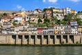 typical Porto houses next to the Douro River, picturesque architecture of lined houses and bright colors. Portugal Royalty Free Stock Photo