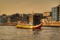 Typical portuguese boats called Rabelos crossing the Douro River Royalty Free Stock Photo