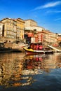 Typical portuguese boats called Rabelos crossing the Douro River Royalty Free Stock Photo