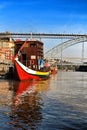 Typical portuguese boats called Rabelos crossing the Douro River