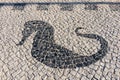 Typical portuguese cobblestone handmade pavement with sea horse