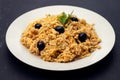 Typical portuguese dish bacalhau a bras with black olives