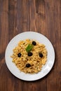 Typical portuguese dish bacalhau a bras with black olives on dish