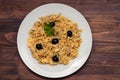 Typical portuguese dish bacalhau a bras on white plate