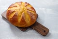 Typical Portuguese Easter cake Folar on wooden board