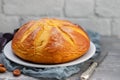 Typical Portuguese Easter cake Folar on white plate