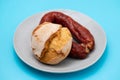 typical portuguese smoked sausage chourico with corn bread Royalty Free Stock Photo