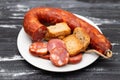 typical portuguese smoked sausage chourico on white plate Royalty Free Stock Photo