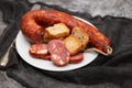typical portuguese smoked sausage chourico on white plate Royalty Free Stock Photo