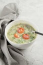 Typical Portuguese soup Caldo Verde on gray background close up