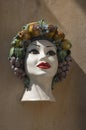 Typical pottery with human head on wall in Sicilia, Italy Royalty Free Stock Photo