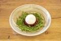 Typical puglia burrata salad with arugula, a bed of dehydrated tomatoes smeared with olive oil