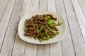 Typical recipe of Chinese restaurant with strips of beef and green peppers sautÃÂ©ed Royalty Free Stock Photo