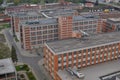 Typical rectangular industrial buildings made of red bricks and vertical windows in the old factory area in Zlin