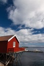 Typical red rorbu fishing hut in town of A Royalty Free Stock Photo