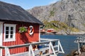 Typical red rorbu fishing hut in village Nusfjord Royalty Free Stock Photo