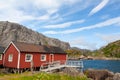 Typical red rorbu fishing hut in village Nusfjord Royalty Free Stock Photo