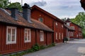 Typical red Swedish wooden houses line the streets of the historic city center of downtown Trosa Royalty Free Stock Photo