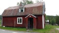 Old Swedish red house near Fatmomake kyrkstad on the Wilderness Road in Vasterbotten, Sweden