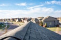 View down the top of an Asphalt shingle roof with ridge cap Royalty Free Stock Photo