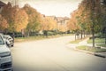 Typical residential neighborhood with American flag in fall seas