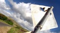 A typical road sign in country Australia, damaged by shotgun blasts. Royalty Free Stock Photo