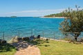 Typical rocky beach with two chairs in Istria Royalty Free Stock Photo