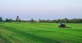 A typical roller mower operating on a sod grass farm Royalty Free Stock Photo