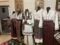 Typical Romanian national costumes embroidered shirts, sheepskin vests and hats, bright kerchiefs,