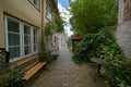 Typical romantic narrow alley with residential buildings in the old town of the hanseatic city Luebeck, Germany