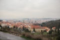 Typical roofs in Prague. Top view - roofs with red tiles in old buildings in Prague. Europe. Empty benches stand in a Royalty Free Stock Photo