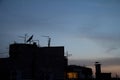 Typical rooftop of Belgrade, Serbia, with the shape of Television antennas, VHF and UHF frequencies, at the top of a European roo