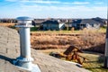 side view of a Galvanized metal chimney exhaust on asphalt roof with a rain cap